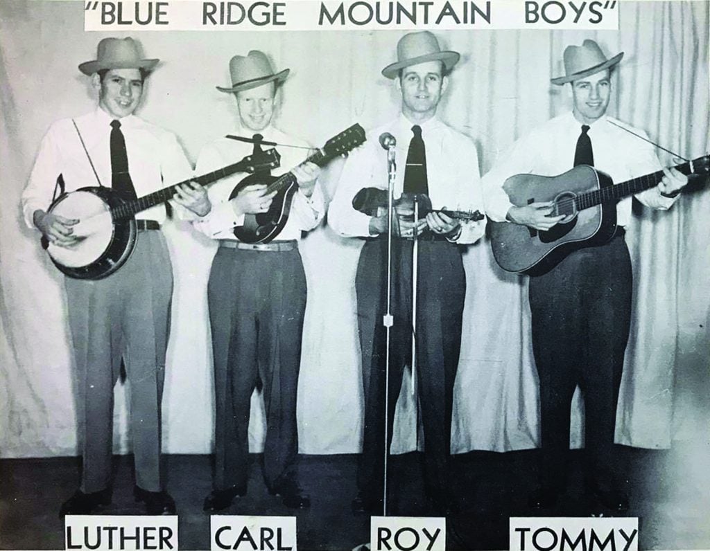 Roy Sykes and the Blue Ridge Mountain Boys, most likely at Radio Station WLSI in Pikeville, Kentucky, ca. 1949. From left to right: Luther (last name unknown), Carl Bevins, Roy Sykes, and Tommy Bevins.  //  Photo Courtesy of Nathan Sykes