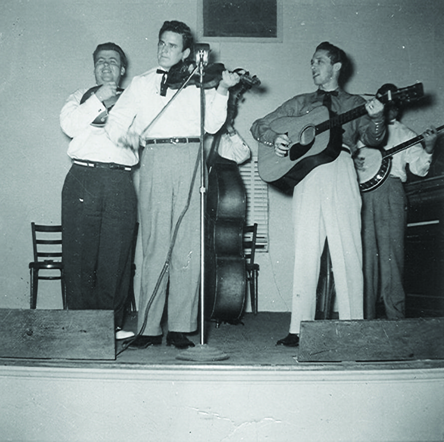 John Hall with Buzz Busby and the Bayou Boys – Front—John Hall. Rear (left to right) Buzz Busby and Pete Pike and unidentified banjo and bass players. Photo Courtesy of Tom Knowles