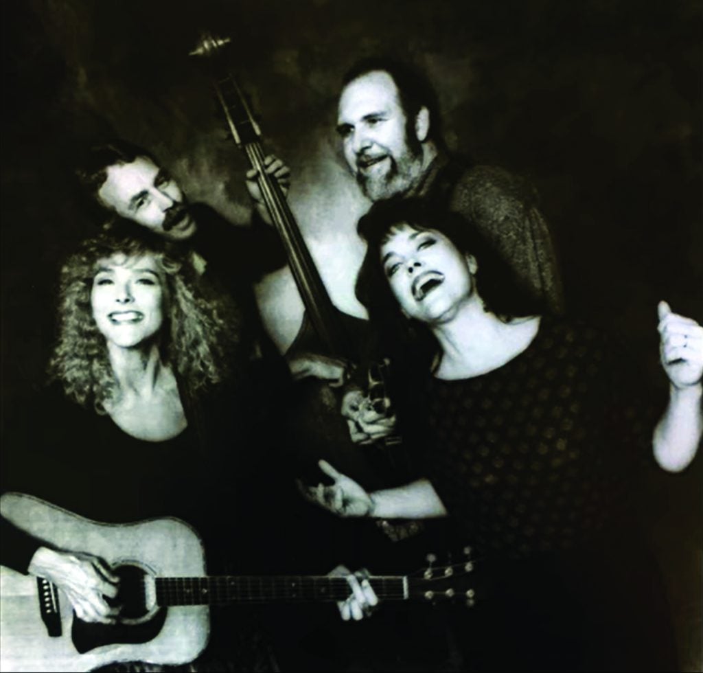 Margaret Archer Bailey with the Cluster Pluckers. Clockwise from lower left: Kris Ballinger, Dale Ballinger, Mark Howard, and Margaret.