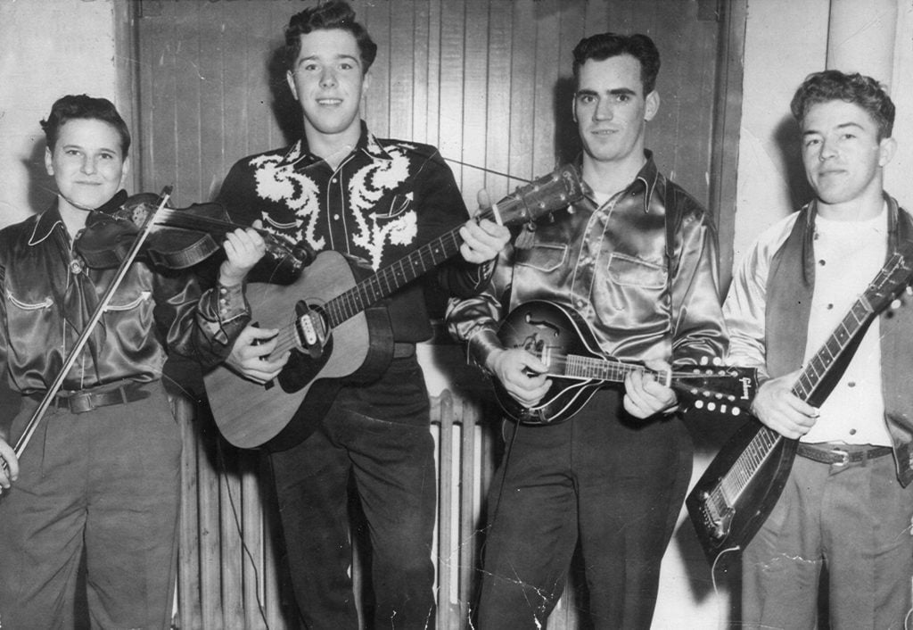 John Hall on left. Joe Hall (with Buzz’s mandolin). Guitar and steel player unidentified. Photo Courtesy of John Hall