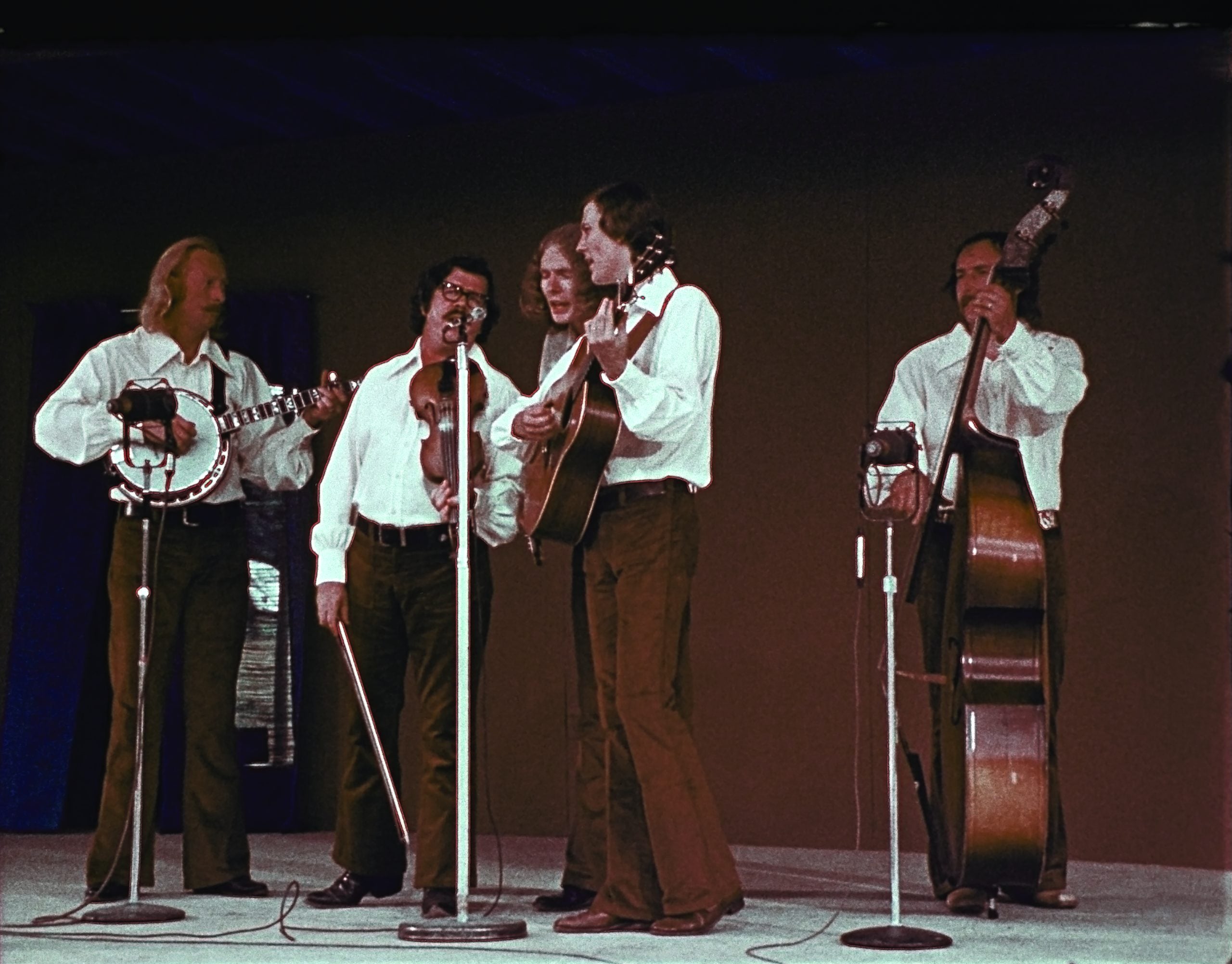 The Country Gentleman:  (left to right) Doyle Lawson, Bill Emerson, Charlie Waller, Bill Yates play their instruments on stage