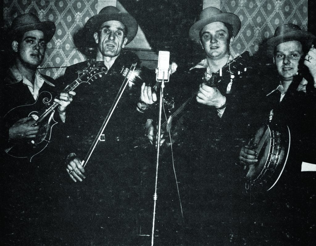 Another band photo, with instruments, ca. early to mid-1947. Left to right: Pee Wee Lambert, Leslie Keith, Carter and Ralph Stanley.