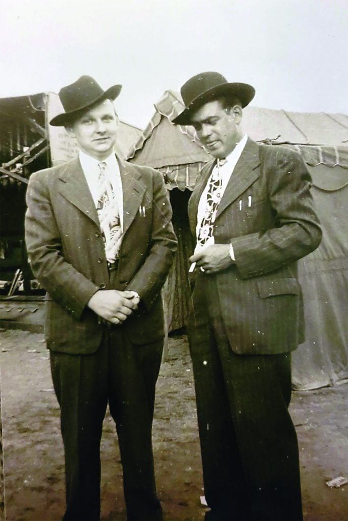 Mitchell Van Dyke, the last banjo player to play in Ralph Stanley’s Clinch Mountain Boys, provided three photos of the Stanley Brothers from September 1948. The group performed at the Dickenson County Fair in Clintwood, Virginia. The trio of musicians is comprised of Pee Wee Lambert and Carter and Ralph Stanley. Carter Stanley and Art Wooten are featured in another while Ralph Stanley and Pee Wee Lambert completed the set.