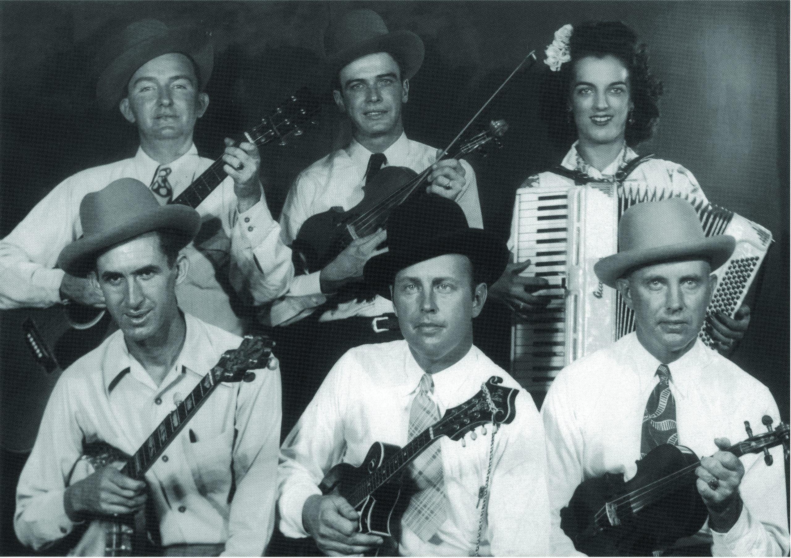 Front row (left to right) David “Stringbean” Akeman, Bill Monroe, Birch Monroe.  Back row (left to right) Lester Flatt, Jim Shumate, Sally Ann Forrester
