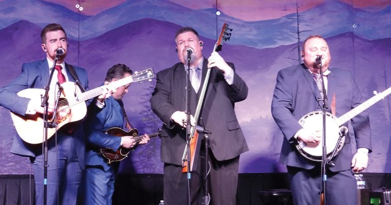 Authentic Unlimited performing at Bluegrass First Class—(left to right) John Meador, Jesse Brock (in background), Jerry Cole, Eli Johnston. // Photo by Gary Hatley