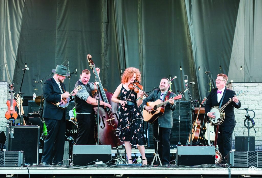 Becky Buller and her band performing on stage at the 2019 Lynchburg Music Festival