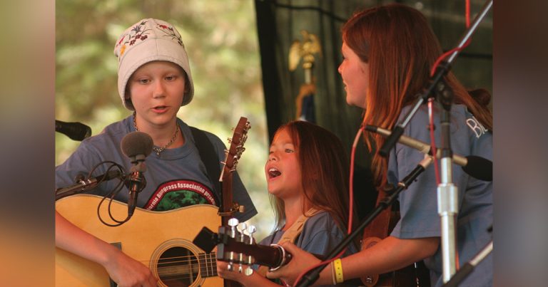 Molly Tuttle, AJ Lee, and Angelica Grim perform as part of the Kids On Bluegrass program at the CBA Father’s Day Festival
