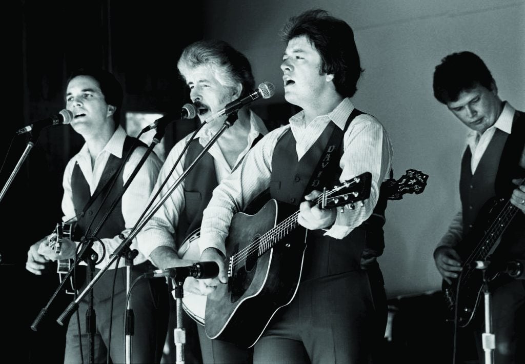 Bluegrass Cardinals performing at the 1986 Nacogdoches Bluegrass Festival, Texas—(left to right) Larry Stephenson, Don Parmley, David Parmley, Dale Perry. Photo by Rick Gardner, courtesy of the Bluegrass Music Hall of Fame & Museum collection.
