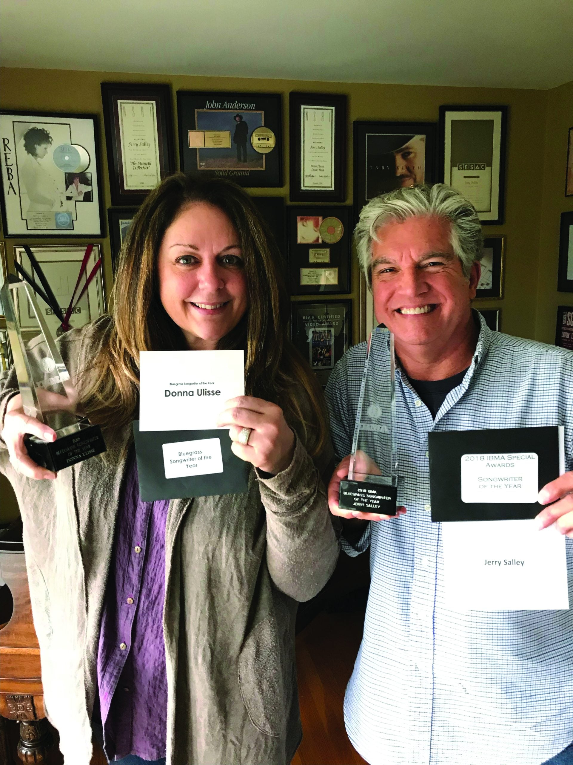 Donna Ulisse with Jerry Salley proudly showing their IBMA “Songwriter of the Year” award