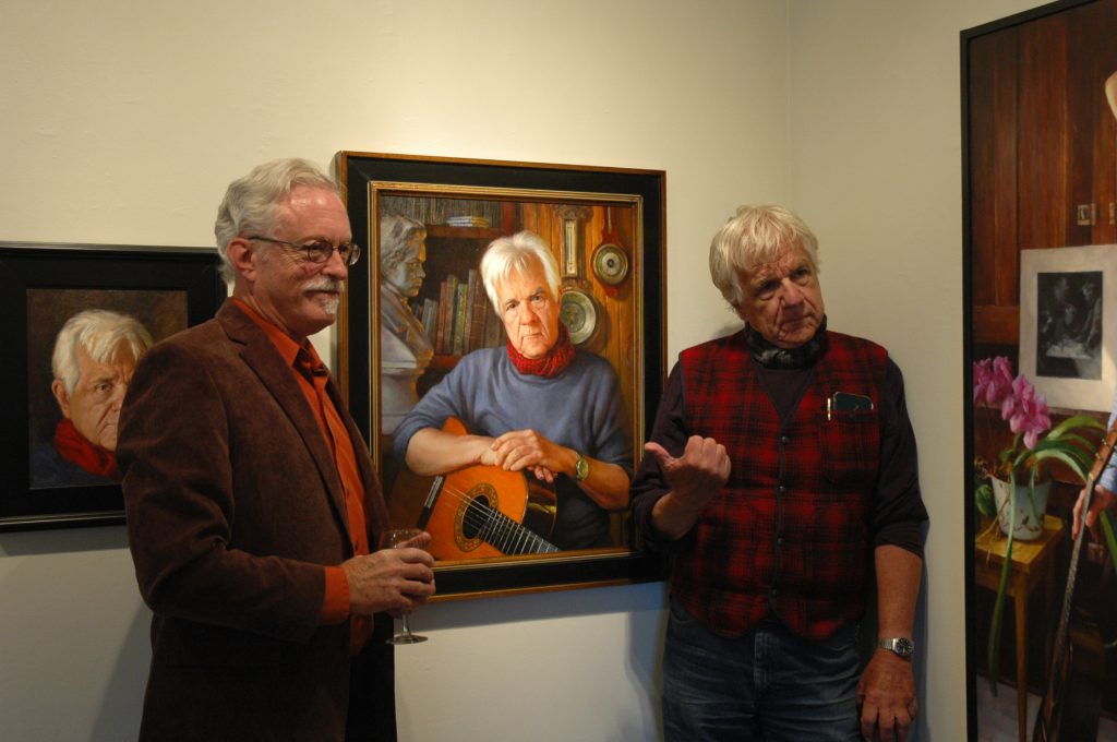 Greg and J.D. with two portraits painted by Greg in 2014