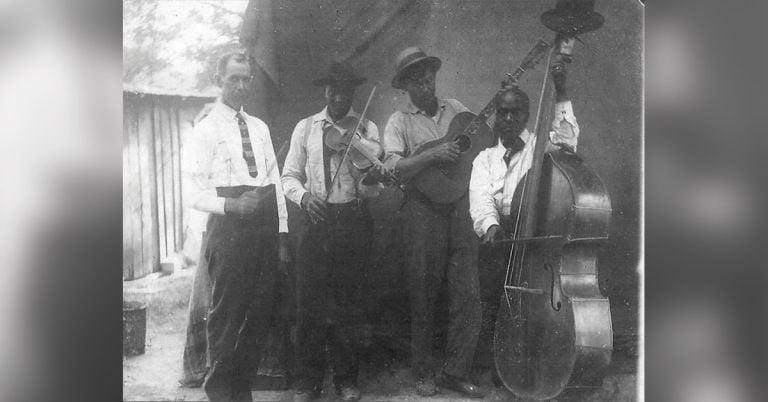 Group photo of Pendleton “Uncle Pen” Vandiver, Arnold Shultz, Unkown, Luther Shultz (Photo courtesy of Roger Givens) playing their instruments