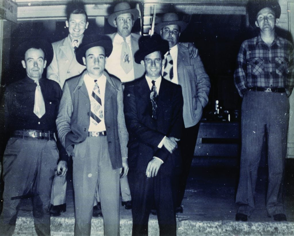 Tomie Thompson featured with Bill Monroe and his Blue Grass Boys in DeRidder, Louisiana, ca. 1946. Front row, left to right: Tomie Thompson, Earl Scruggs, and Howard Watts (Cedric Rainwater); back row, left to right: Jimmy Kish, Bill Monroe, Chubby Wise, and Lester Flatt.