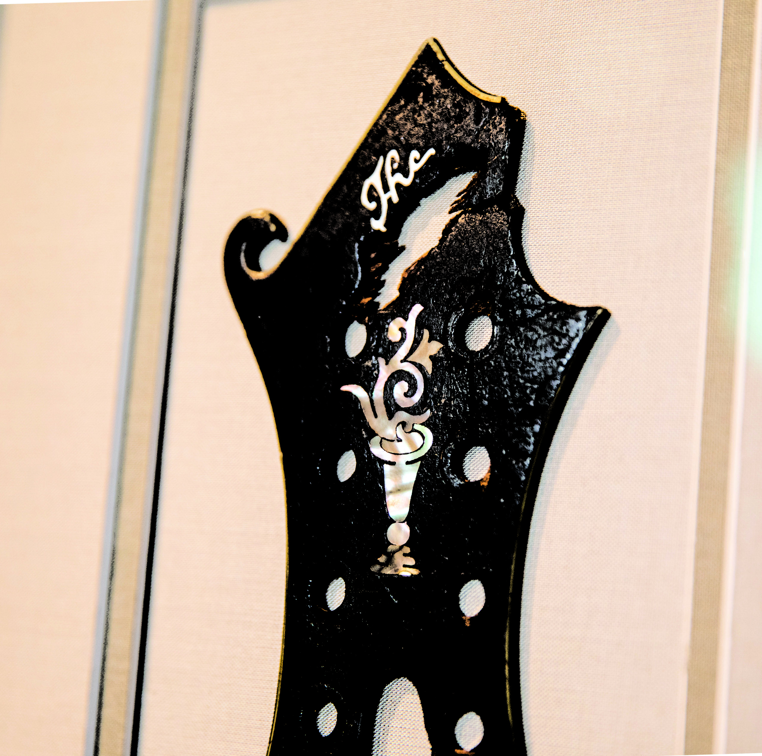 Close up photo of Bill Monroe's headstock