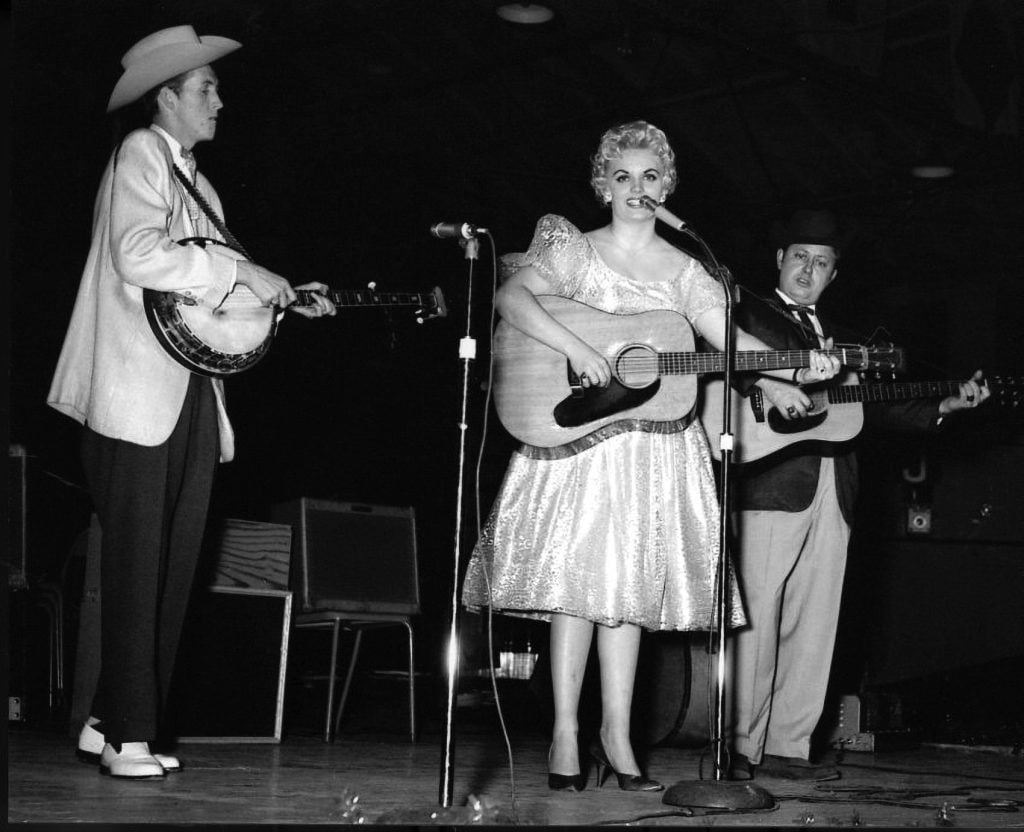  J.D Crowe, Donna Darlene, and Jimmy Martin in 1958 at the WWVA Package Show in Ottawa Auditorium at Lansdowne Park in Ottawa Ontario, Canada. Photo by Ron Petronko, courtesy of the Bluegrass Music Hall of Fame & Museum.