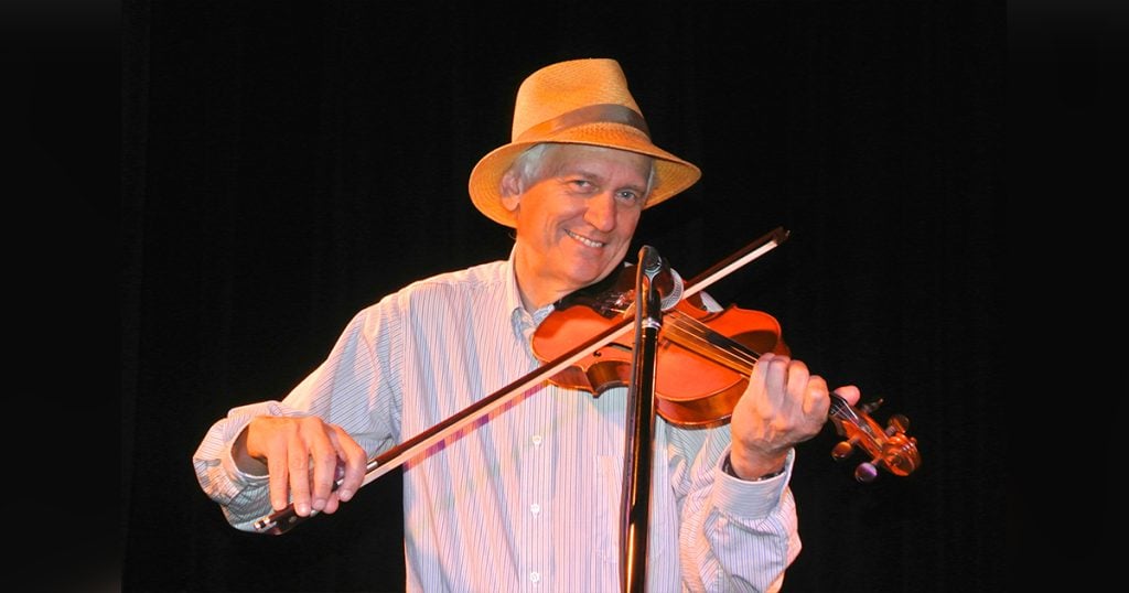 Jack Tuttle playing his fiddle