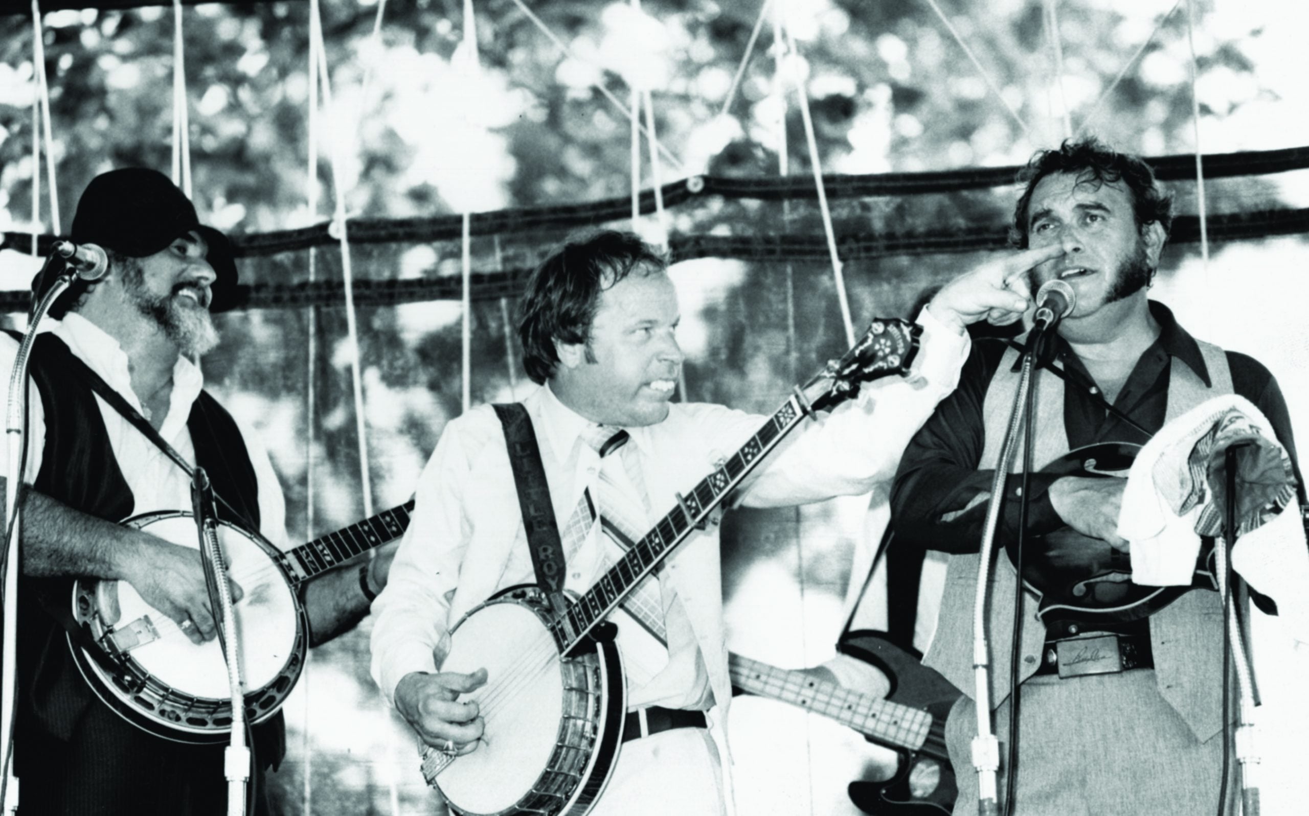 Bobby and Sonny Osborne in Lexington, Kentucky cutting up with Little Roy Lewis. Photo by Mark Morris