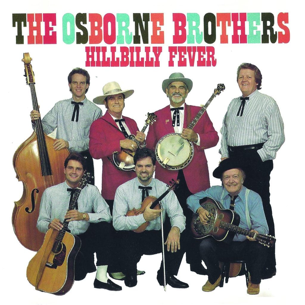 Lester Flatt and Earl Scruggs and the Foggy Mountain Boys smile for a photo