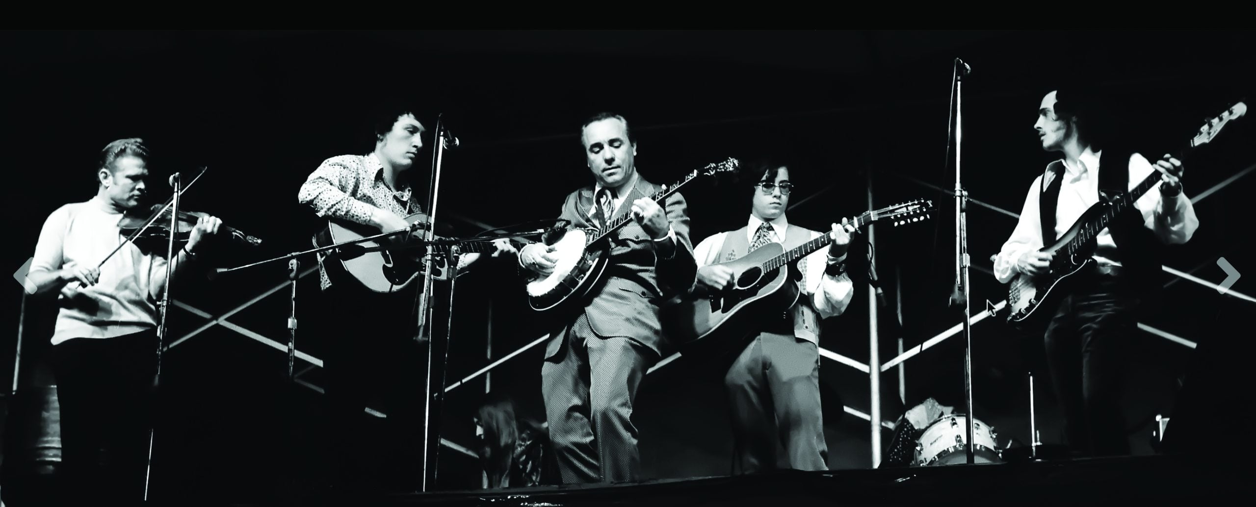 Earl performing with his sons and Vassar Clements as the Earl Scruggs Revue
(left to right): Vassar Clements, Randy Scruggs, Earl Scruggs, Steve Scruggs, Gary Scruggs. Photo by Daniel Duffin