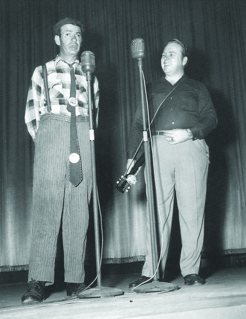 Smokey Davis sings on stage with Mac Wiseman