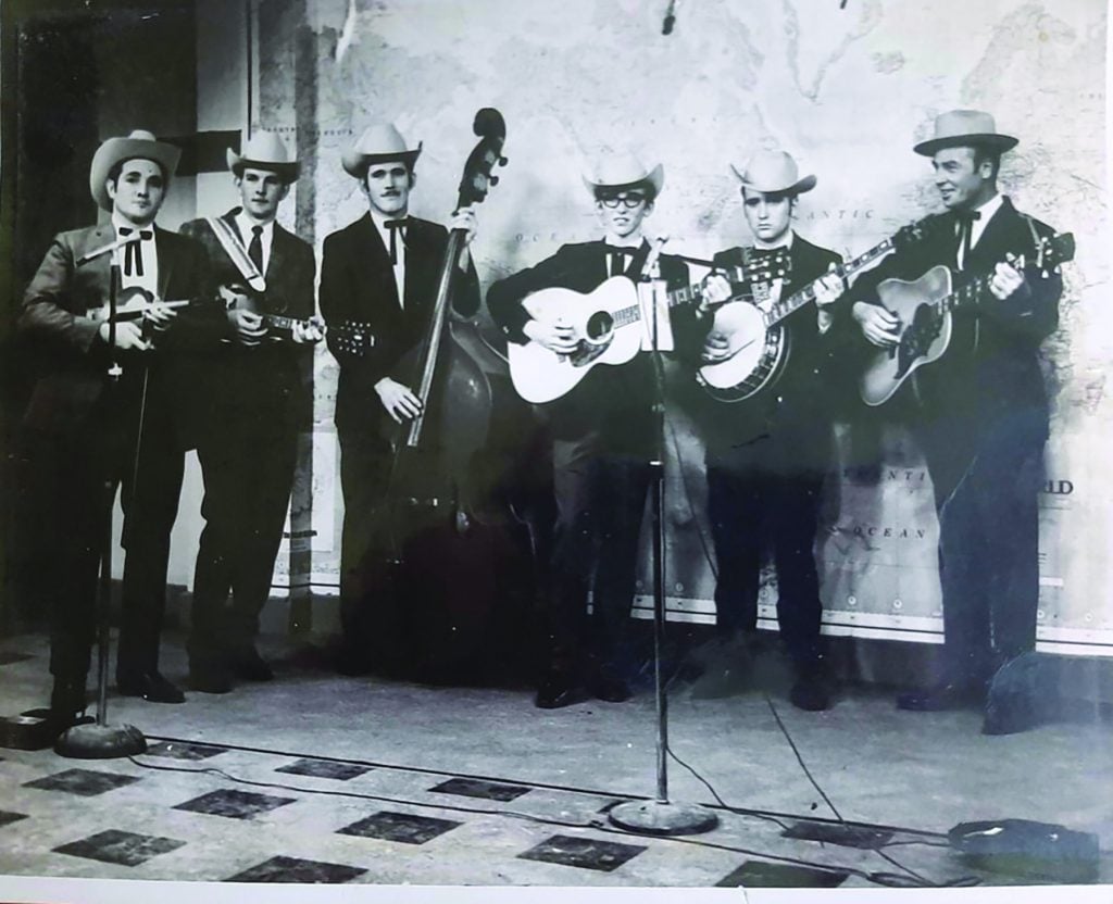 Upper: Sourwood Mountain Boys, 1968 at WKYH TV station. (left to right):  A.M. DeBusk, Woody Whit, Marvin Adkins, Keith Whitley, Dwight Whitley, Bob Spurlock. Photo Courtesy of Flo Whitley