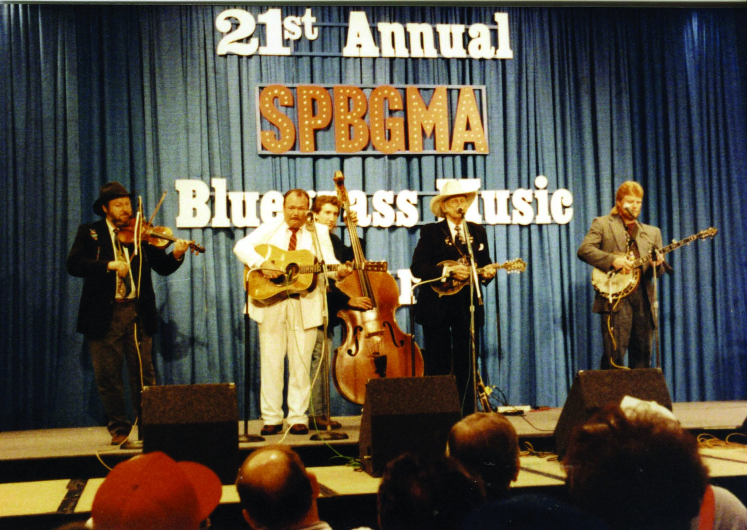 James King Band backing Bill Monroe at SPBGMA -  L to R: Tad Marks, James King, Jason Moore, Bill Monroe, Adam Poindexter