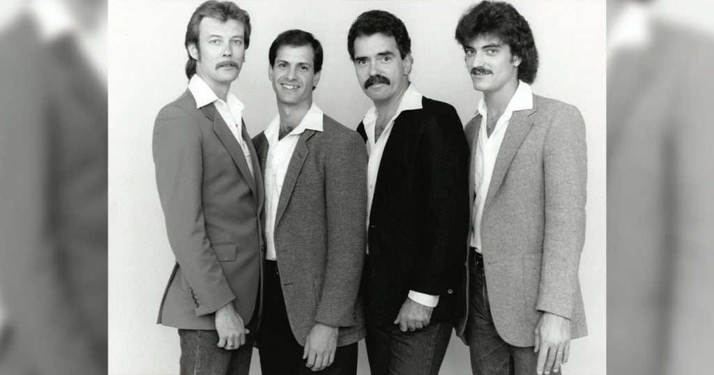 The Tony Rice Unit, circa 1985. (left to right) Tony Rice, Mark Schatz, Jimmy Gaudreau, Wyatt Rice pose for a group photo