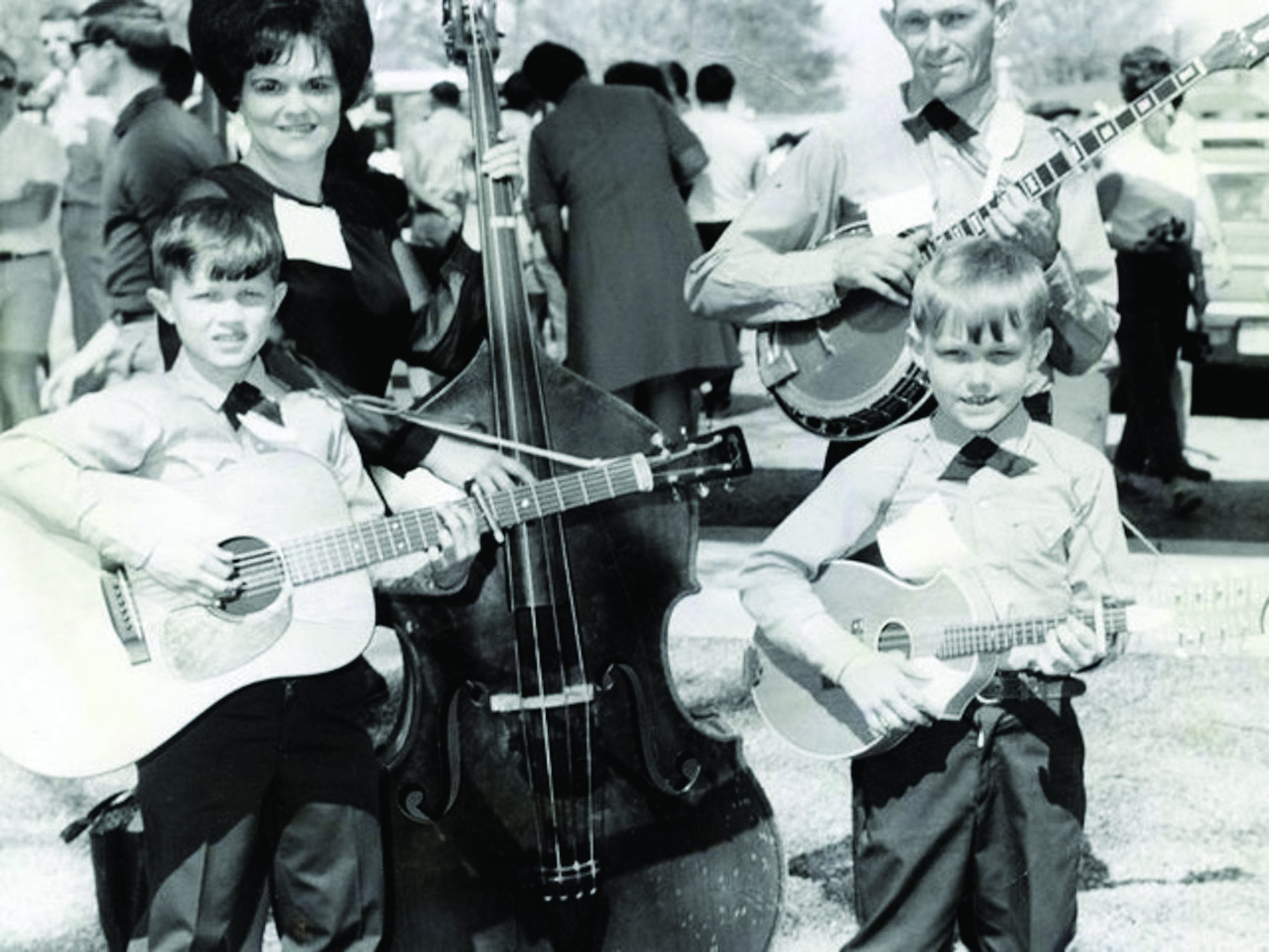 Billy (guitar) and Terry (mandolin) with their parents (Hazel and Pat Smith) at the Union Grove Fiddlers Convention