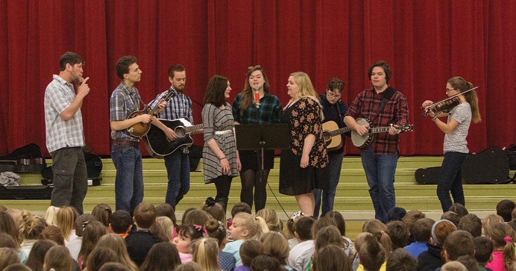 The Spring 2015 edition of the West Virginia University Bluegrass and Old-Time Band performing at an elementary school show in Marshall County, WV. Photo by Raymond Thompson.