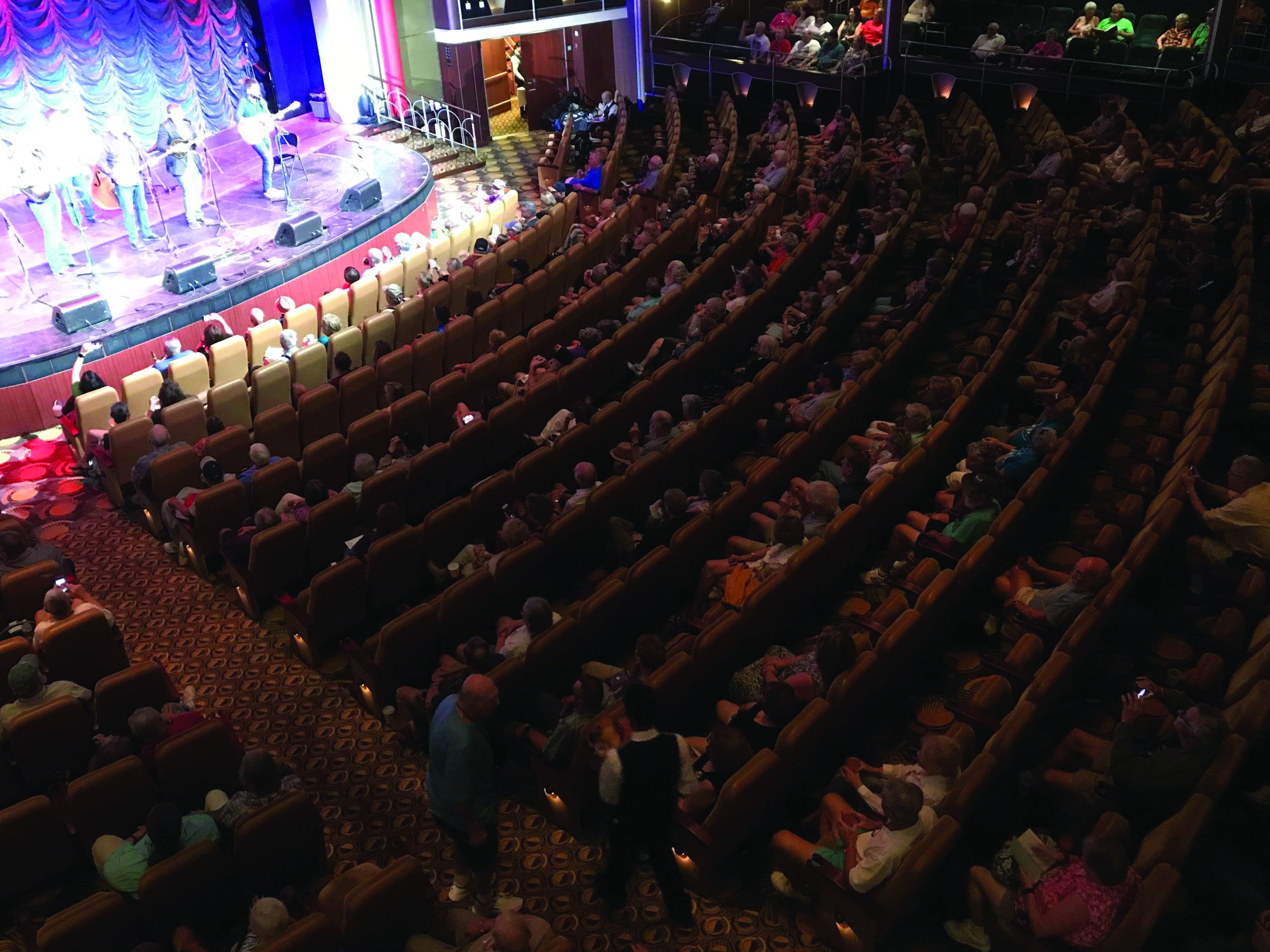Sideline performs on stage and the Royal Theater on one of the Stewarts’ bluegrass cruises in the Caribbean.