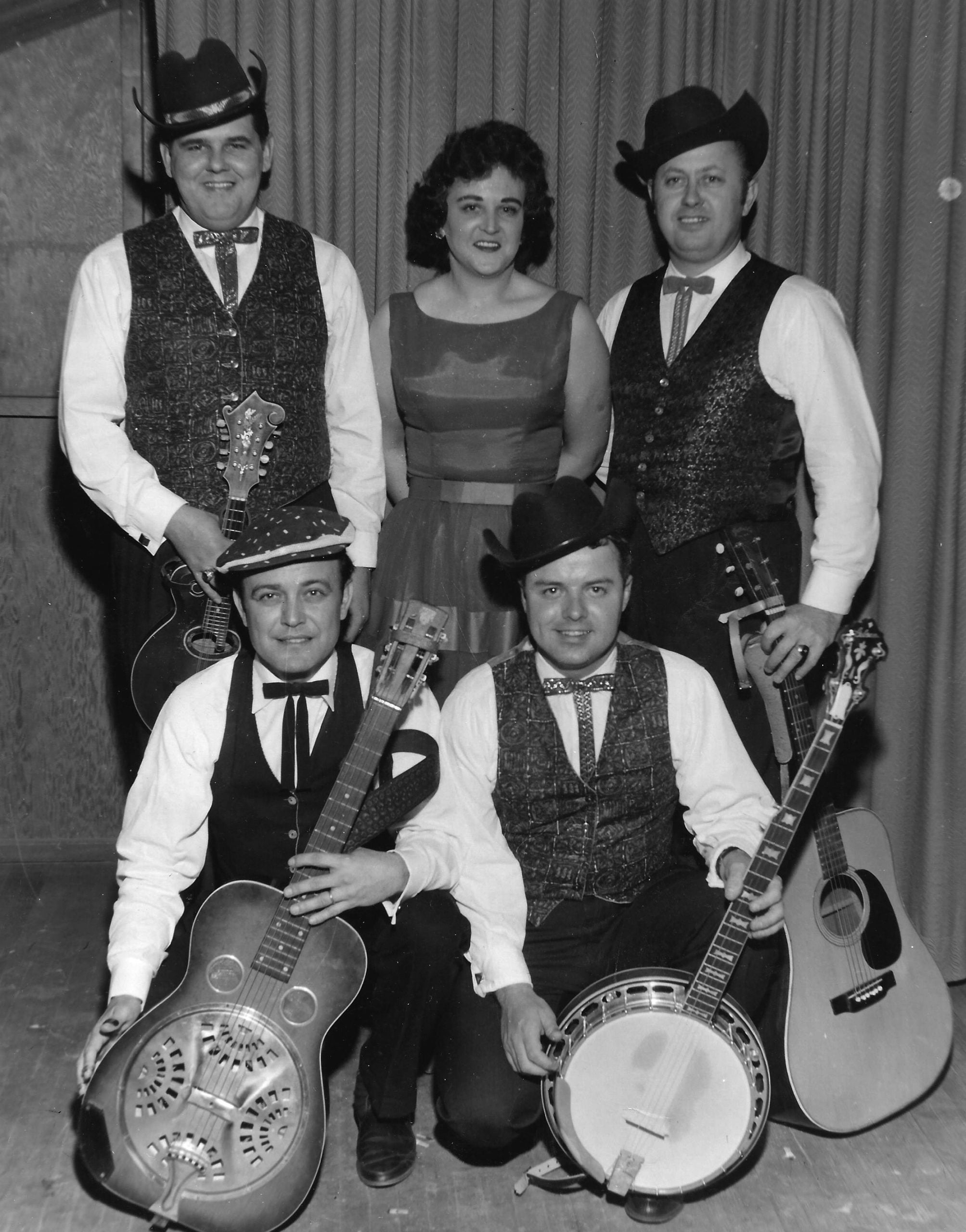 Jimmy Martin and the Sunny Mountian Boys in 1962. Back Row: Paul Williams, Judy Lee, Jimmy Martin. Front Row: Buck Josh Graves, Billy Edwards in Toronto, Canada.  //  Photo donated by Good Home Grown Music, courtesy of the Bluegrass Music Hall of Fame & Museum.