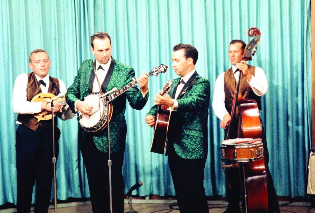 Bill Emerson, Cliff Waldron and the Lee Highway Boys on the set of WMET in Baltimore, Maryland, ca. July 1968. Left to right: Garland Alderman (mandolin), Bill Emerson (banjo), Cliff Waldron (guitar), and Earl Brown (bass). The snare drum in the lower right corner of the photo was left in place from Delmar Delaney’s group. (Photo courtesy of the Emerson family.)