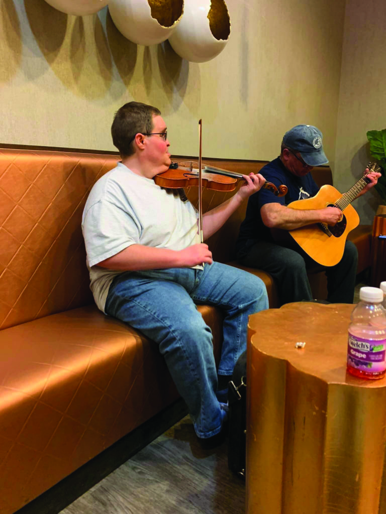 (lower):  Michael Cleveland joined in the jam.  Photo by Mark Hargis