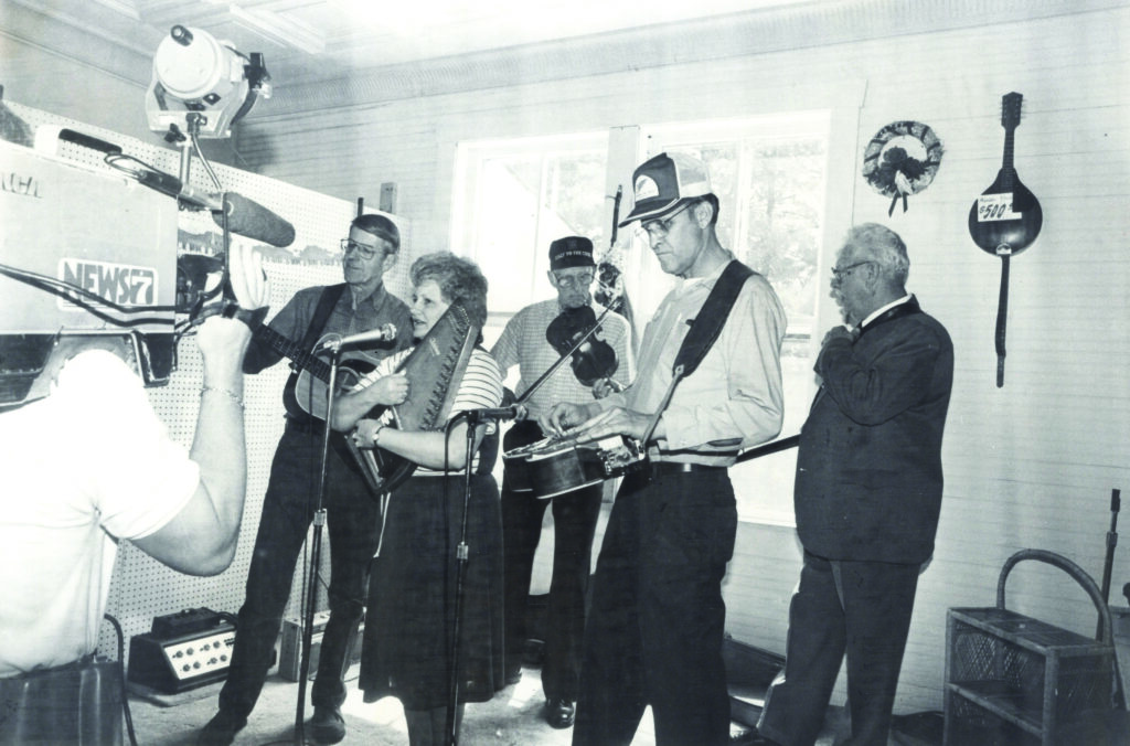 A historic photo capturing Roanoke’s WDBJ-7 filming a segment on the music back in the 1980’s (in the picture: Freeman Cockram, Janet Turner and Ivan Weddle). Archival Photo Courtesy of Floyd Country Store