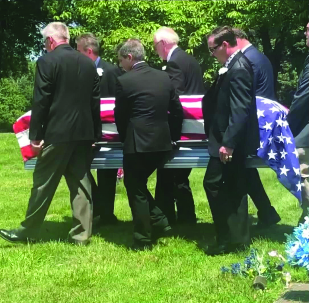 Bobby Osborne being laid to rest by pallbearers. // Photo by Luann Adams Smith.