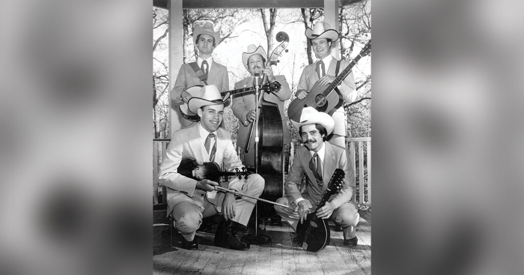The Johnson Mountain Boys: (kneeling left to right) Eddie Stubbs, Ed D’Zmura (standing left to right) Richard Underwood, Larry Robbins, Dudley Connell