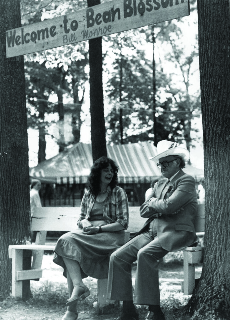 Upper: Kathy Kallick of the Good Ol’ Persons speaking with Bill 
Monroe at Bean Blossom.  Photo Courtesy of Kathy Kallick. 

Lower: Bill Monroe performing with Doc Watson at Bean Blossom, 1971.  Photo by Ron Petronko. Courtesy of Bluegrass Music Hall of Fame and Museum.