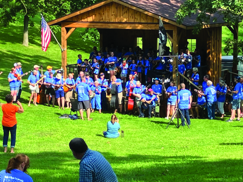 Keith Yoder leading the Strawberry Jam Camp on-stage performance at the 2023 Backbone Bluegrass Festival.  Photo courtesy of Linzy Martin