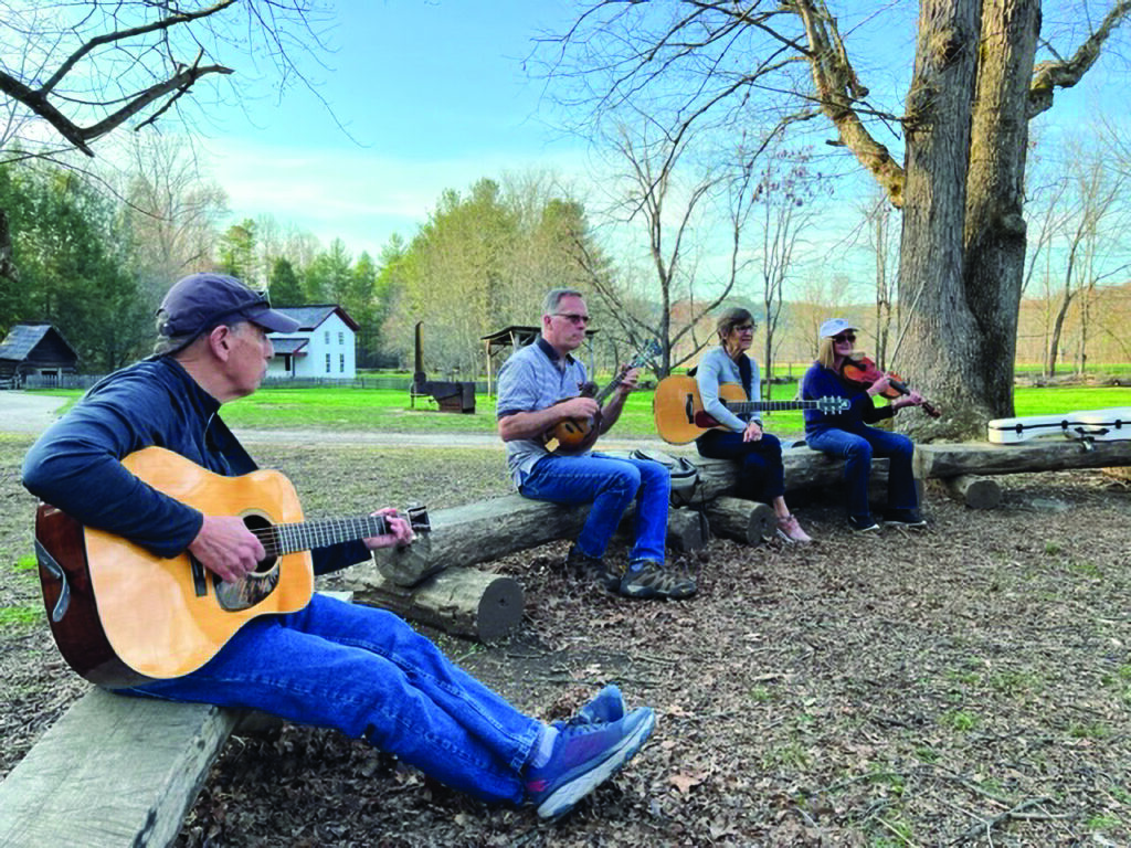 Keith Yoder jamming with students in Cades Cove, Smoky Mt. National Park.  //  Photo by Ellen Cromer