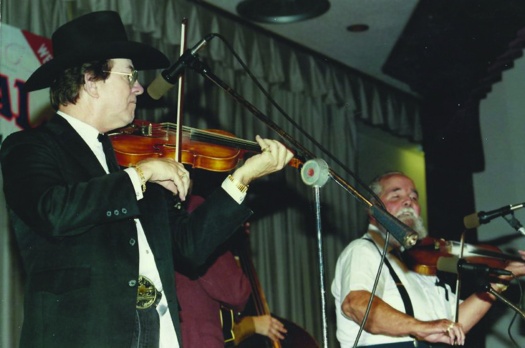 Bobby Hicks and Chubby Wise performing at Jekyll Island, Georgia in 1990.  //  Photo by Penny Clapp, courtesy of the Bluegrass Music Hall of Fame & Museum.

