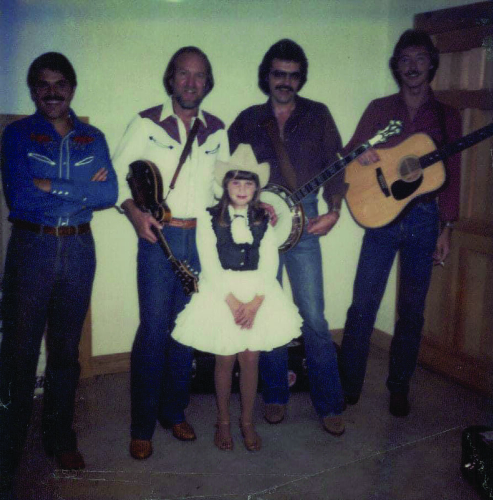 Randy Graham, Doyle Lawson, Gena Britt (in front), Terry Baucom and Jimmy Haley.  Photo courtesy of Gena Britt.

