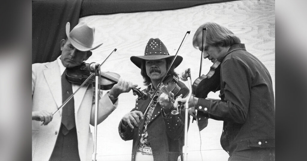 Kenny Baker, Bobby Hicks, and Bryon Berline at the 1975 Dick Tyner’s Golden West Bluegrass Festival. Photo by Sue & John Averill, courtesy of the Bluegrass Music Hall of Fame & Museum.