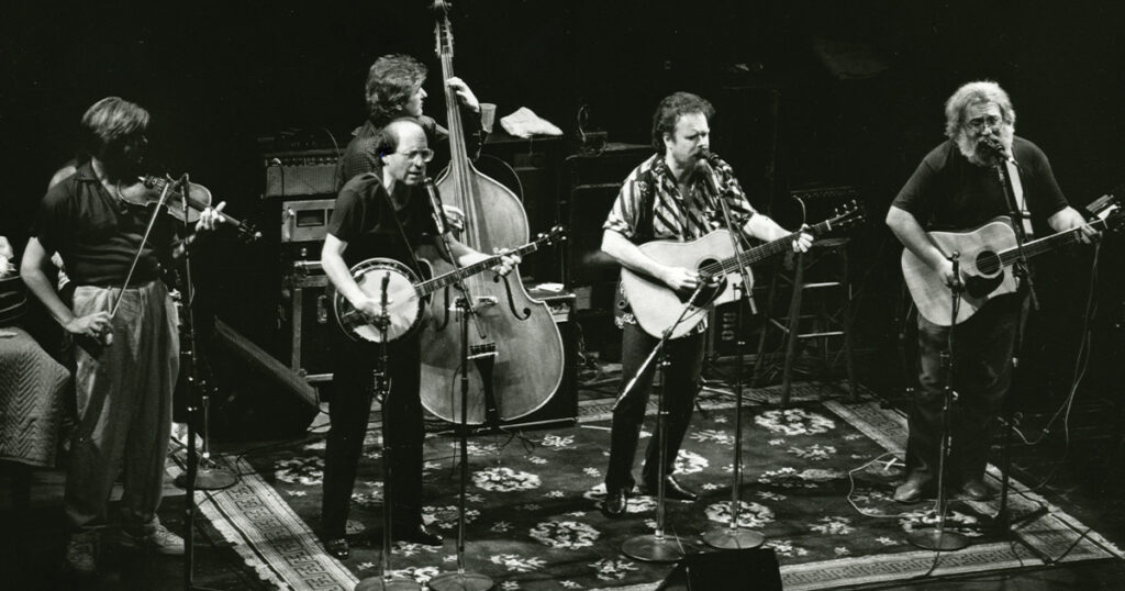 The Jerry Garcia Acoustic Band with Kenny Kosek, Sandy Rothman, John Kahn, David Nelson, and Jerry Garcia on October 31, 1987. Photo by Jay Blakesberg.