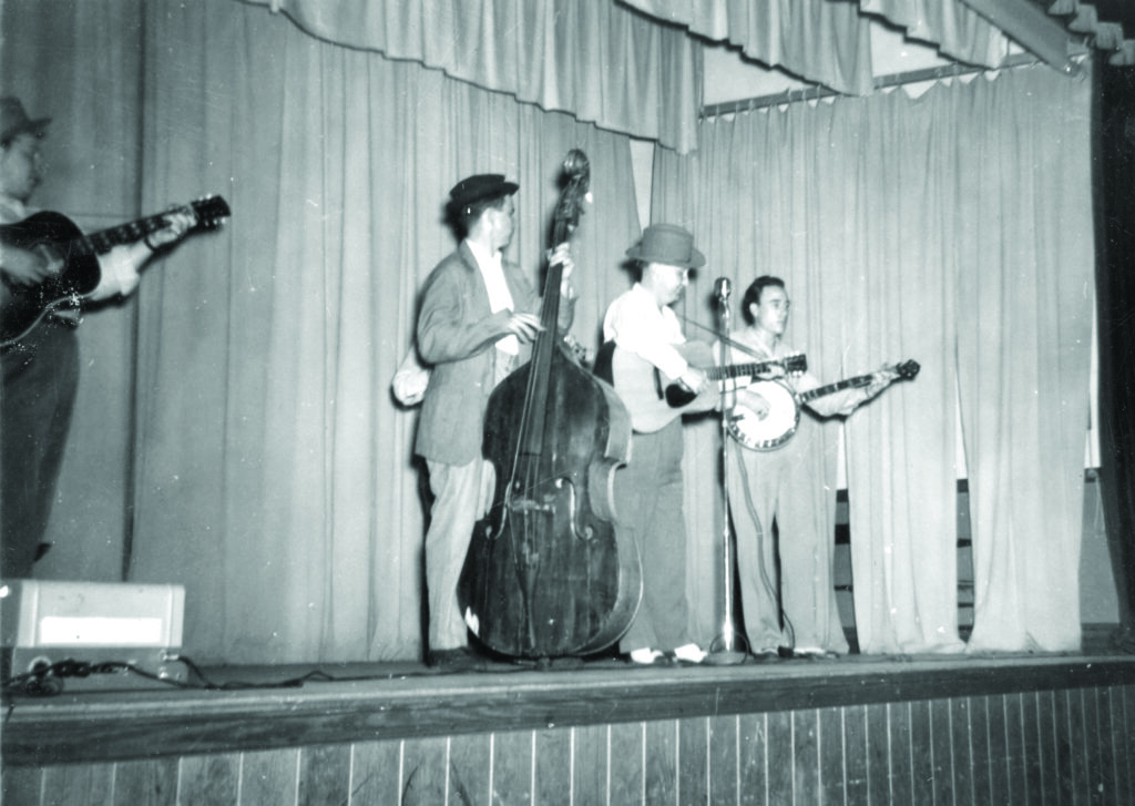 An early show featuring the Foggy Mountain Boys in 1948 (left to right) Mac Wiseman, Cedric Rainwater, Lester Flatt and Earl Scruggs.  Photo Courtesy of the Earl Scruggs Center.
