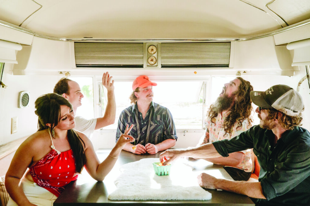 Never Come Down in the Airstream “green room” at the Topaz Farms concert venue.  
Photo by Julia Vargas