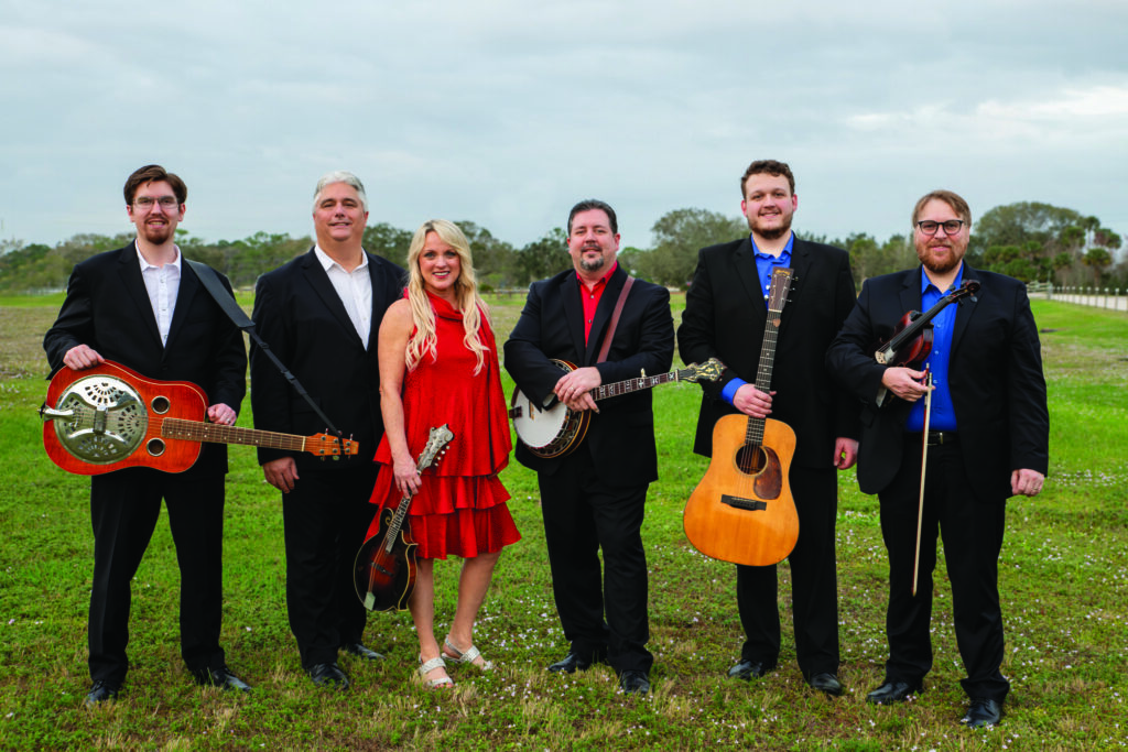 Rhonda Vincent and the Rage (left to right) Jacob Metz, Mickey Harris, Rhonda Vincent, Aaron McDaris, Zack Arnold and Adam Haynes. Photo Courtesy of Rhonda Vincent