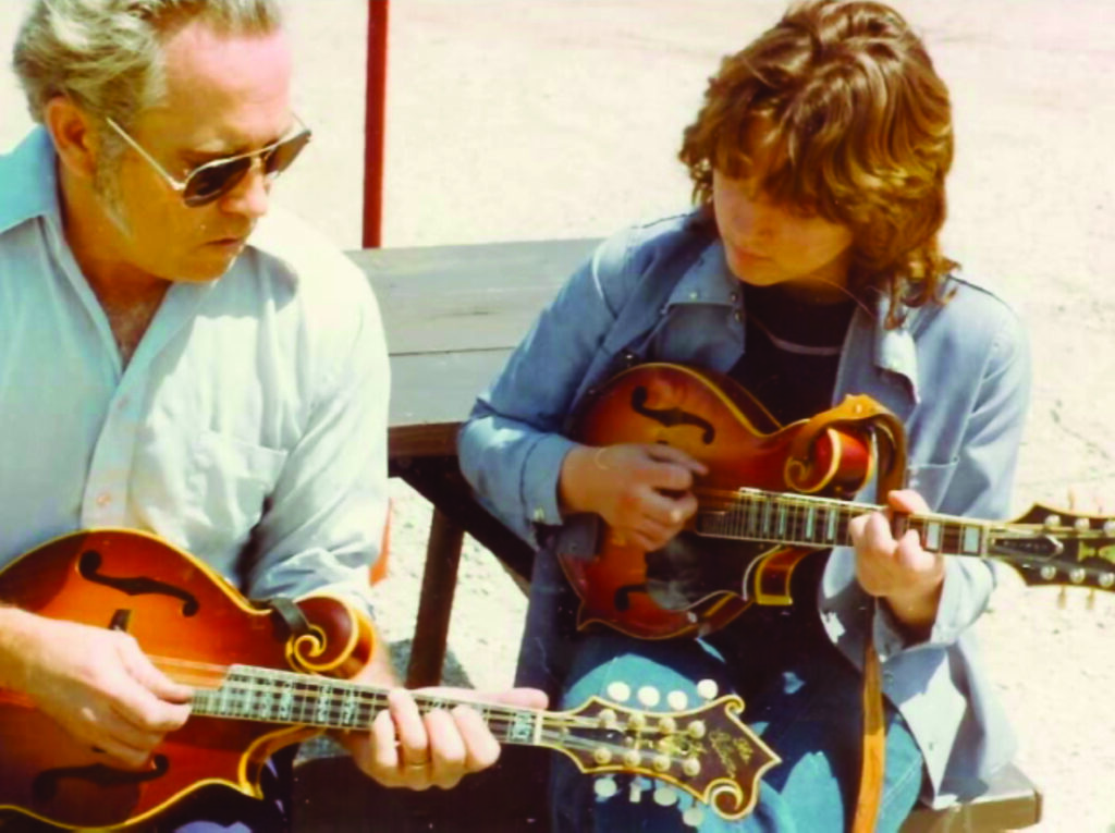 Gene Hayes, who Rhonda calls a “dear friend and mandolin mentor” takes time to show Rhonda some new mandolin licks. Photo Courtesy of Rhonda Vincent