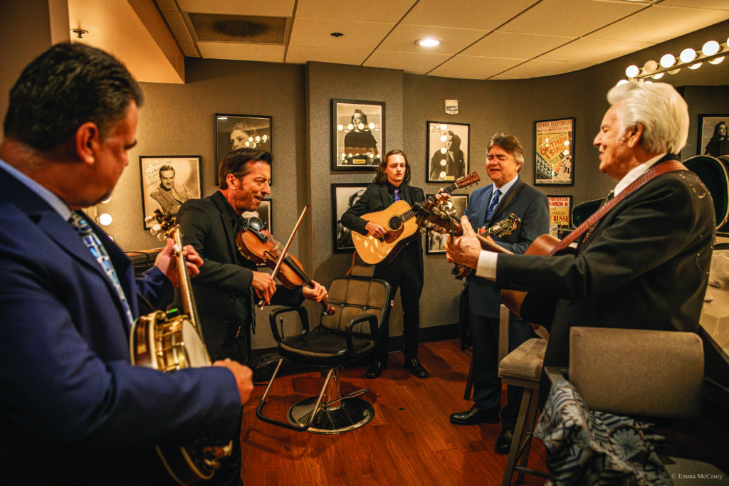 The Del McCoury Band warming up before a show (left to right) Rob McCoury, Jason Carter, Heaven McCoury, Ronnie McCoury and Del McCoury.  
Photo by Emma McCoury