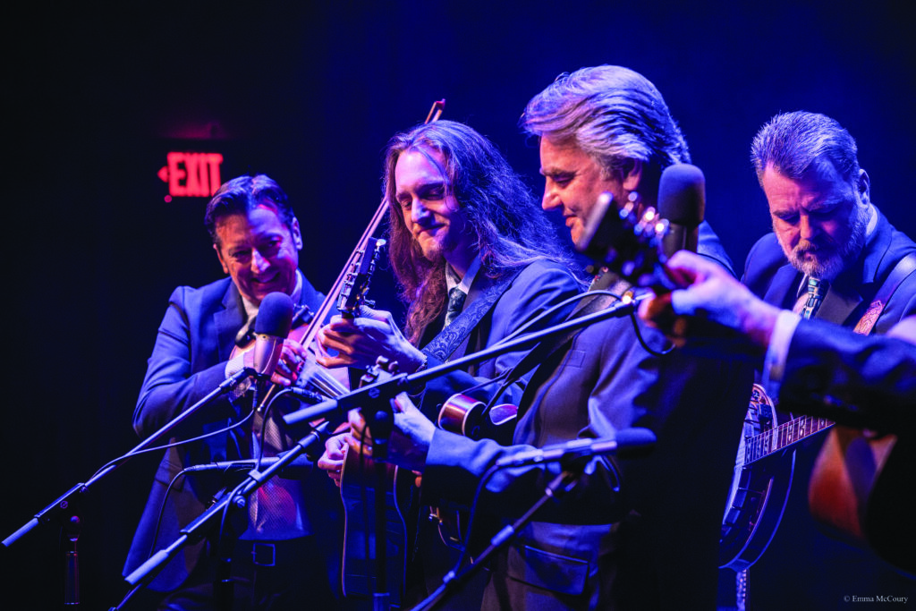 Heaven McCoury performing with his father Ronnie (mandolin), his uncle Rob (banjo) and Jason Carter (fiddle). // Photo by emma mccoury