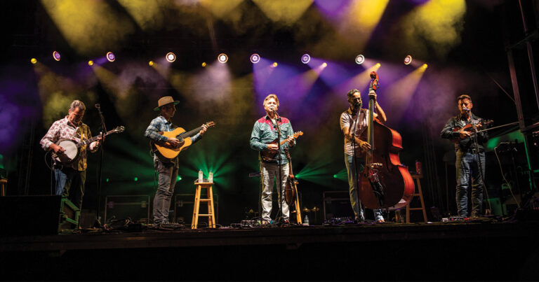 The Travelin’ McCourys performing at ROMP in Owensboro, Kentucky in 2024. (left to right) Rob McCoury, Cody Kilby, Ronnie McCoury, Alan Bartram and Jason Carter. // Photo by Alex Morgan