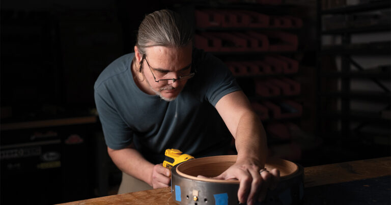 Luthier Chris Pariso works on an Ome Banjo // Photo Courtesy of The Gold Tone Group